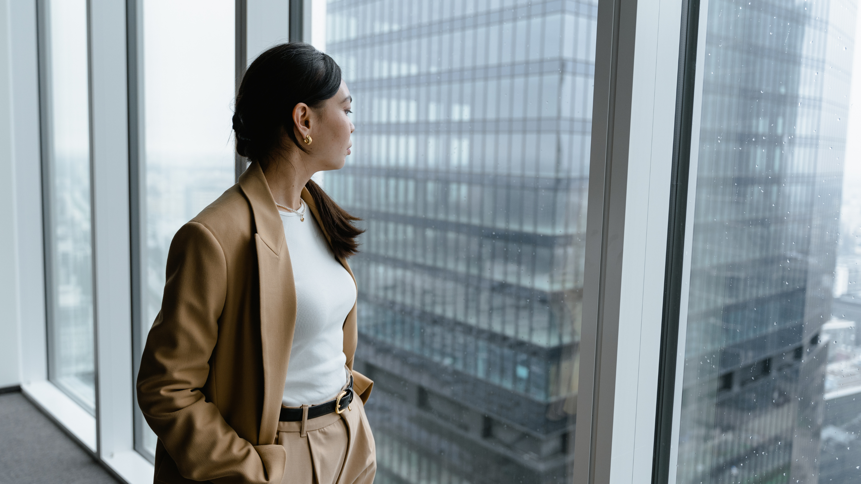 business woman looking at the window